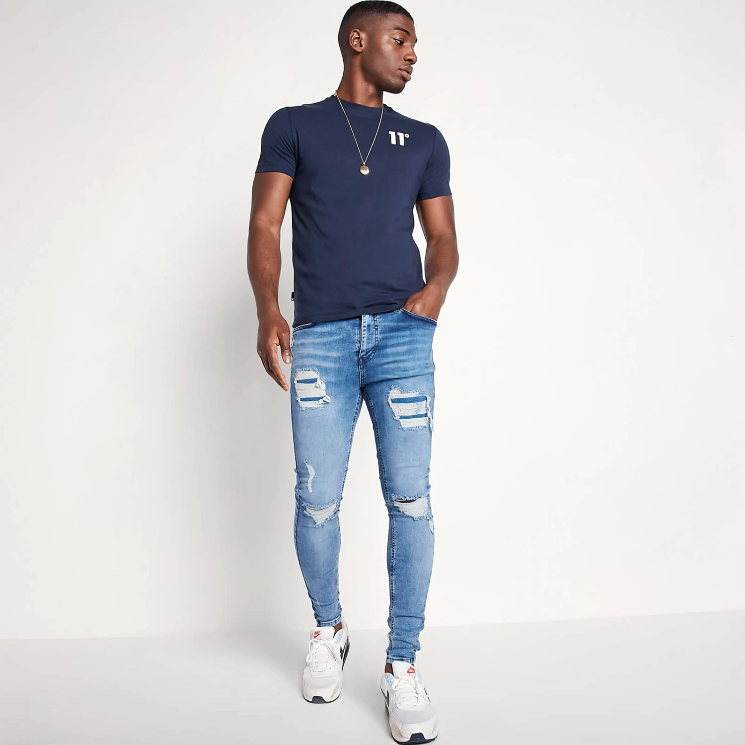 11 Degrees Sustainable Distressed Jeans Skinny Fit – Mid Blue Wash 2 11 Degrees Sustainable Distressed Jeans Skinny Fit – Mid Blue Wash - Image 2